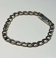 Full view of Figaro link bracelet laid flat