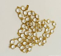 Necklace laid flat showing full length and crystal stations