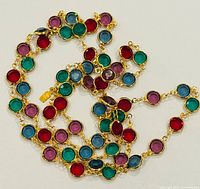 Coiled necklace showing multicolor bezel-set round crystals
