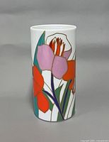 Front view of cylindrical porcelain vase with multicolor stylized floral decoration