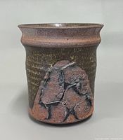 Front view showing abstract relief decoration and glaze coloration