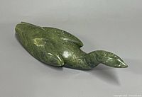 Top view of green stone bird carving