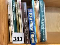 Spine view of eight books on bookshelf