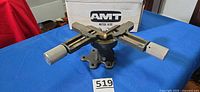 AMT cast-iron miter vise on blue surface with box behind