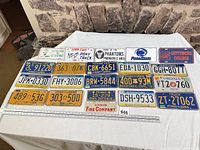 Overall shot of all license and novelty plates laid out on table