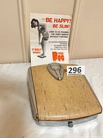 Scale front view with advertisement behind