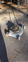 Full view of Murray push mower showing handle, deck and wheels
