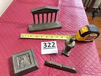 All four paperweights with ruler for scale