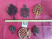 All six trivets with measuring tape