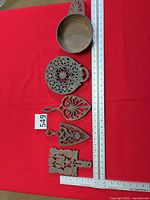 Top view of all five items alongside ruler for scale