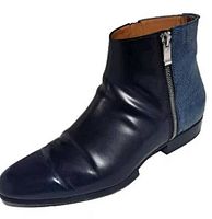 Side view of right boot showing black leather front, blue lizard-embossed back, side zipper