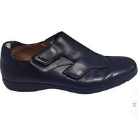 Left side view of shoe showing profile, leather condition, velcro monk strap design
