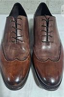 Top view of both shoes showing lacing, leather finish and toe condition