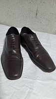 Top view of both shoes showing lacing, cap toe and leather condition