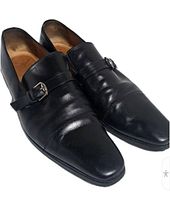 Top view of both Gucci black leather loafers