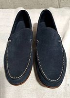 Top view of both blue suede loafers showing overall condition and stitching