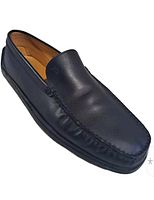 Left side view of single black leather Tod’s loafer