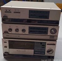 Front view of stacked AIWA R80 tuner, C80 pre-amp, L80 cassette deck