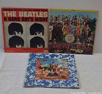 Front covers of all three LPs upright, showing album art