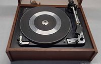 Top view of Dual 1009 SK turntable showing platter, tonearm, controls and wood plinth