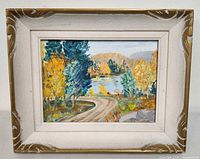 Front view of framed landscape painting