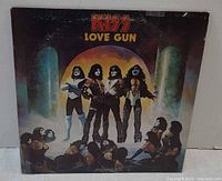 Front cover of KISS “Love Gun” LP showing artwork and title