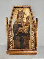 Full view of painted Madonna and Child wood icon in frame