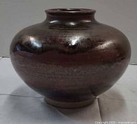 Front view of glazed stoneware bowl showing color and shape