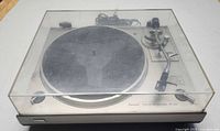 Top angled view of Sansui SR-232 turntable with dust cover closed