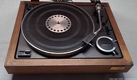 Top view of Sony 5520 turntable showing platter, tonearm, controls and wood plinth
