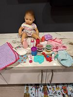 All items laid out including doll and accessories