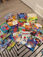 All books spread on floor showing covers and titles