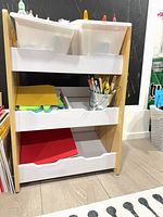 Front view of cart showing bins and shelves