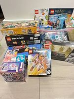 Group shot of boxed LEGO sets, zip bags and polybags
