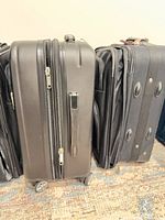Hard-shell spinner carry-on alongside soft-side spinner case