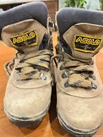 Front view of both boots showing Asolo logos, laces, toe condition