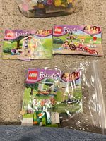 Three instruction manuals and bagged parts