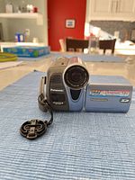 Front view of Panasonic PV-GS19 camcorder with battery inserted