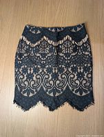 Full view of black lace skirt front side