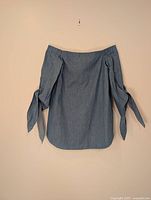Front view of blue off-shoulder blouse