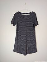 Front view of striped dress on hanger