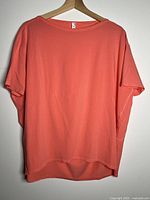 Front view of salmon Lululemon T-shirt on hanger
