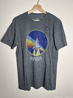 Front of charcoal NASA graphic T-shirt on hanger