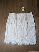 Front view of lace skirt laid flat