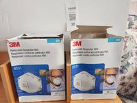 Front view of two 3M 8511 N95 respirator boxes