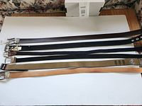 All six belts laid flat