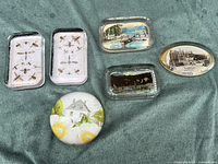 Group shot of all six paperweights