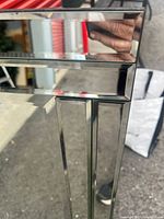 Close-up of bevelled edge detailing on mirror frame