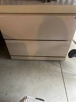 Front view of beige two-drawer Reff lateral filing cabinet