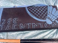 Blue and black badminton carry bag with racket graphic and "BADMINTON" text